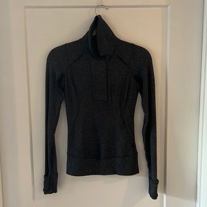 Lululemon half zip pullover with thumbholes, cuffins, and front zip pocket.